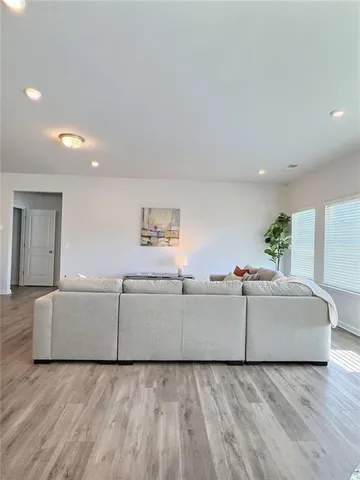 a view of a livingroom with furniture and cabinet