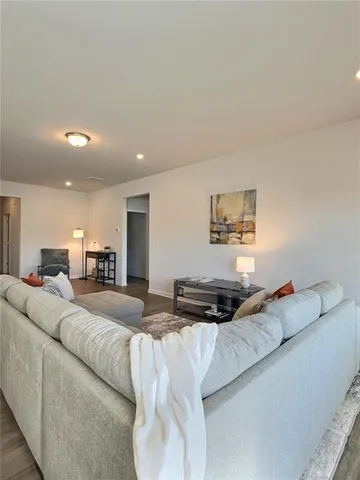 a bedroom with a bed and a couch