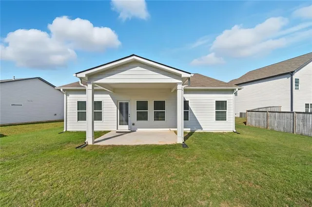 a front view of a house with a yard and porch