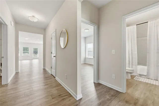 wooden floor with white walls