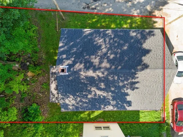 a view of a street with a building in the background