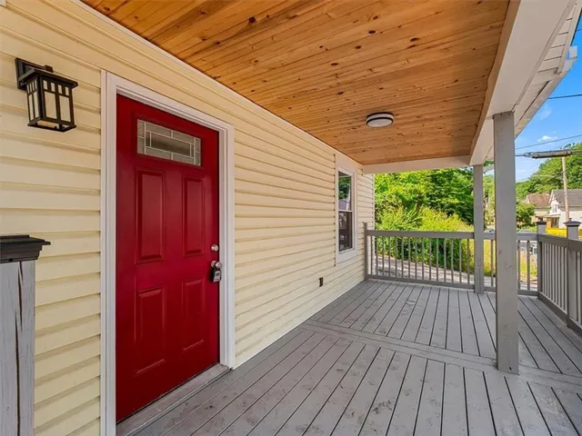 a view of a house with porch and wooden floor