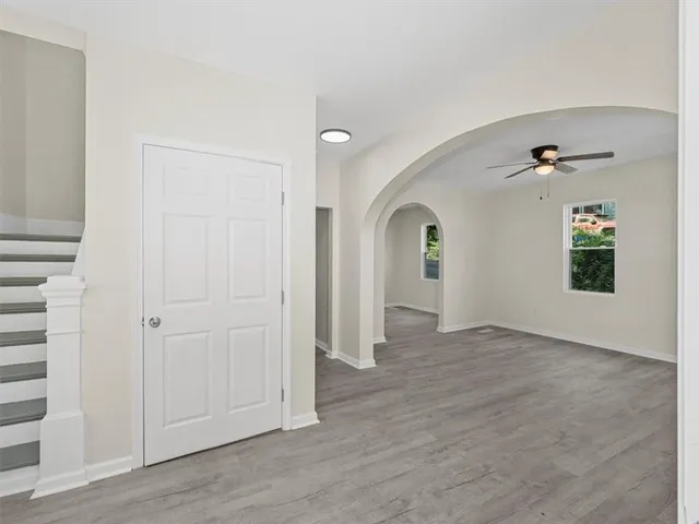 wooden floor with white walls