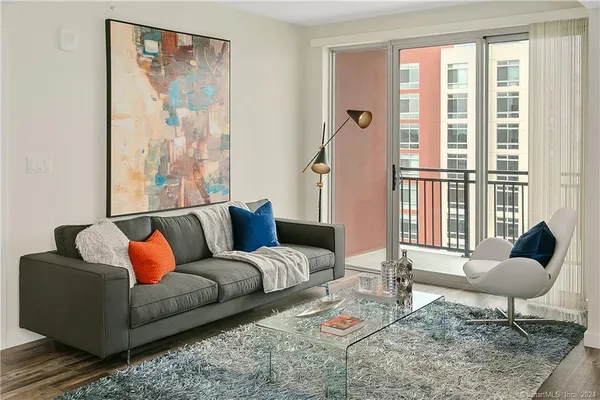 a living room with furniture and a large window