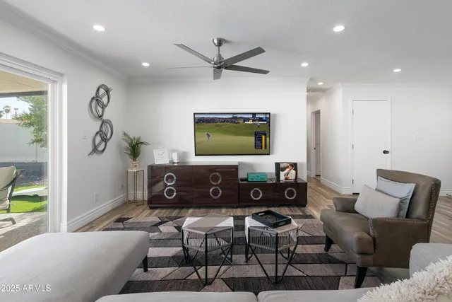 a living room with furniture and a flat screen tv