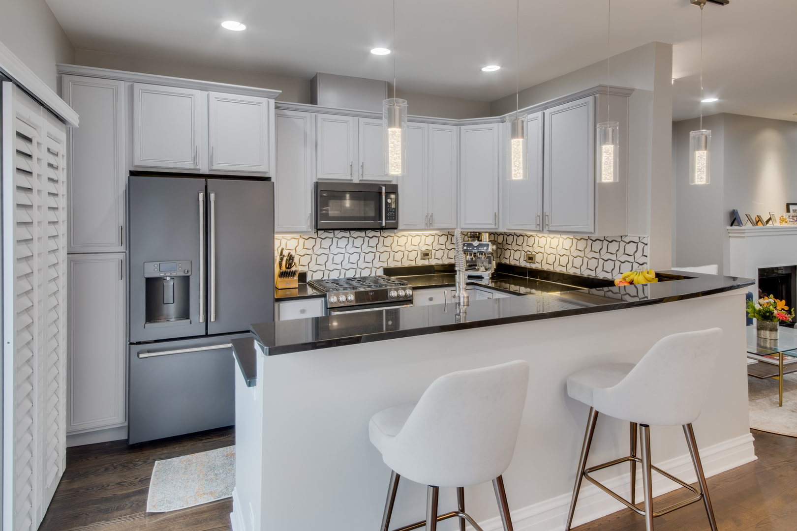 1316 West Fillmore Street, Unit B Chicago, IL 60607 - Photo 20 of 42 a kitchen with stainless steel appliances granite countertop a sink a stove a refrigerator and white cabinets