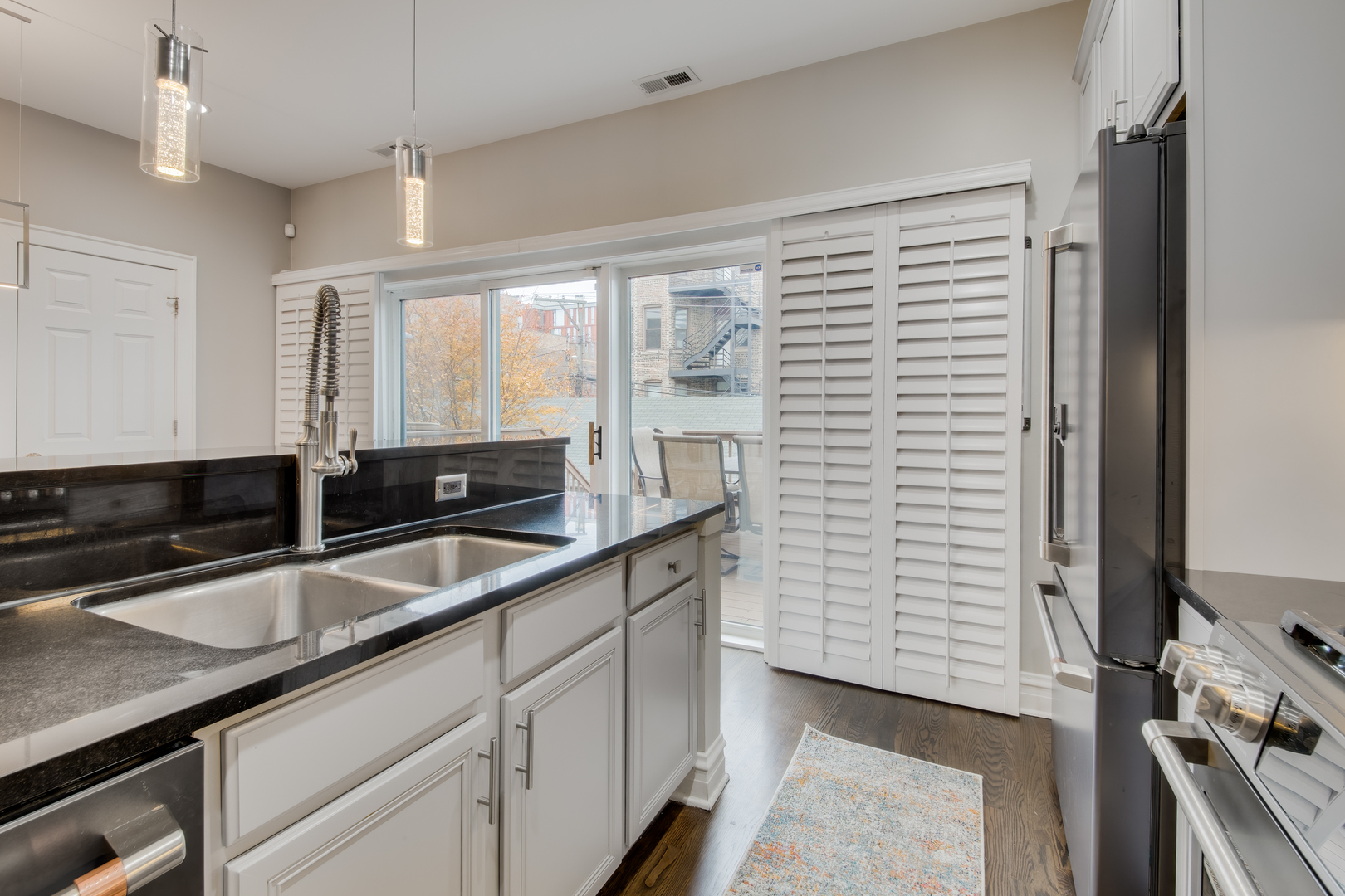 1316 West Fillmore Street, Unit B Chicago, IL 60607 - Photo 22 of 42 a kitchen with a sink and cabinets
