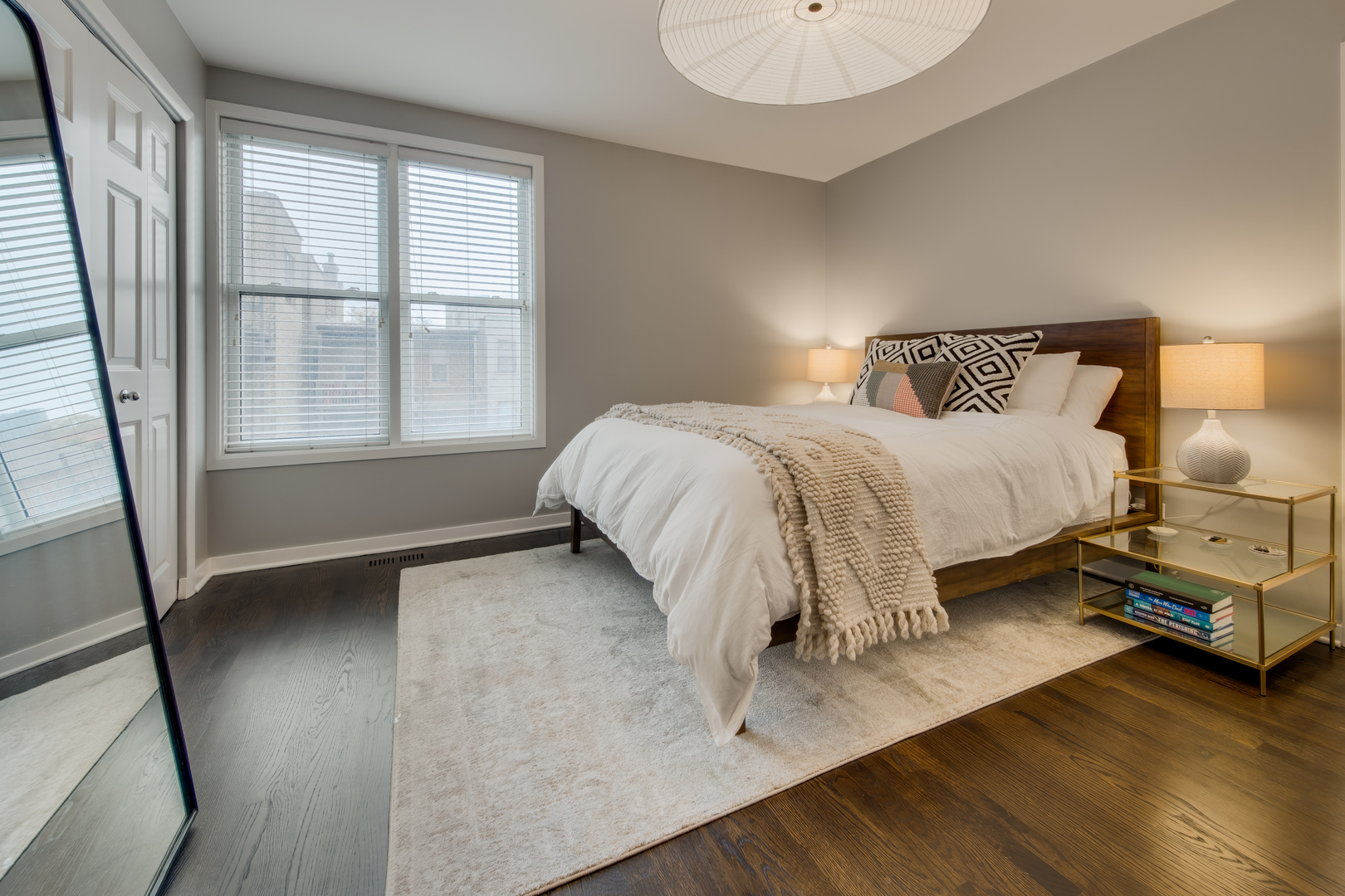 1316 West Fillmore Street, Unit B Chicago, IL 60607 - Photo 24 of 42 a bed sitting in a bedroom next to a window