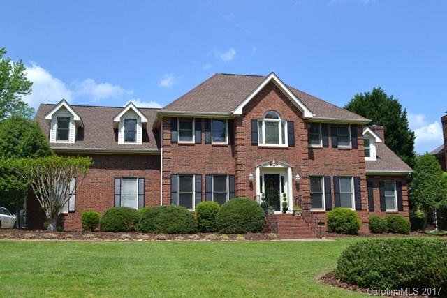 front view of brick house with a yard