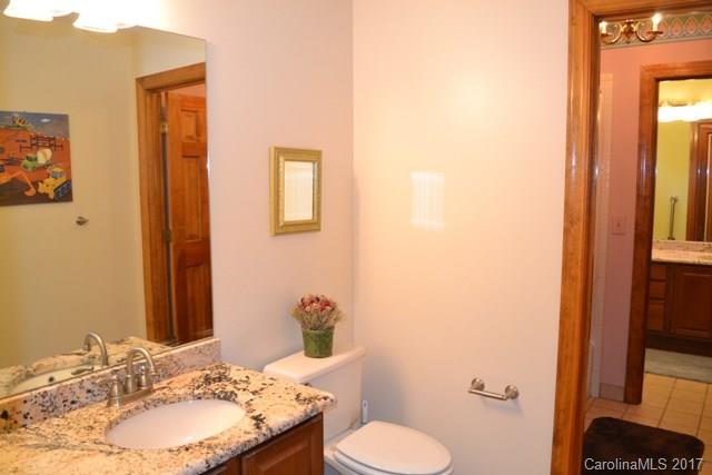 483 Beacon Knoll Lane Fort Mill, SC 29708 - Photo 15 of 21 a bathroom with a granite countertop sink toilet and mirror