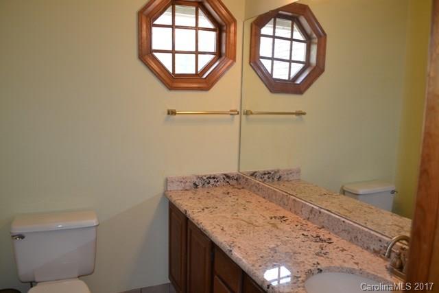 483 Beacon Knoll Lane Fort Mill, SC 29708 - Photo 16 of 21 a bathroom with a granite countertop sink and a mirror
