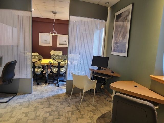 a view of a workspace with furniture
