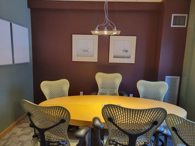 a bathroom with a toilet a sink and a mirror