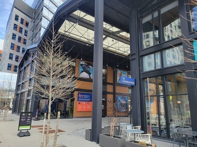 a multi story building with large windows