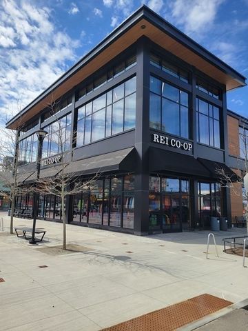 a view of a building with outdoor seating