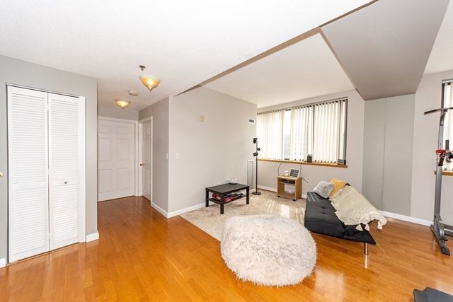 a bed room with a bed and a chair