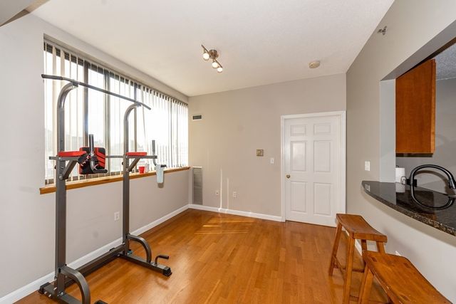 a view of a kitchen with a sink and cabinets