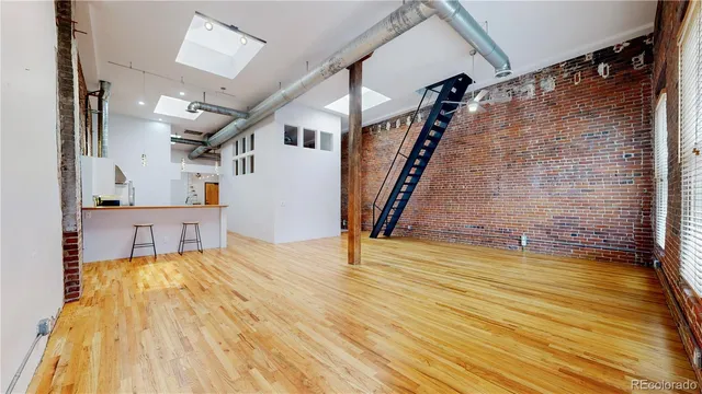 a view of a living room with a wooden floor