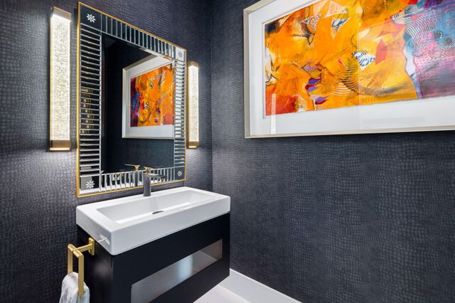 a bathroom with a sink a mirror and a window