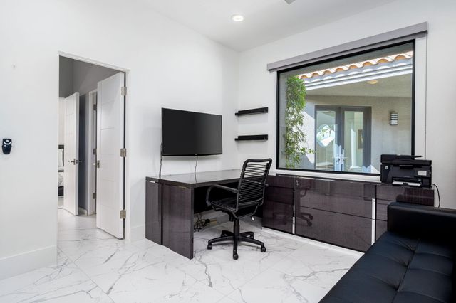 a view of workspace with livingroom view