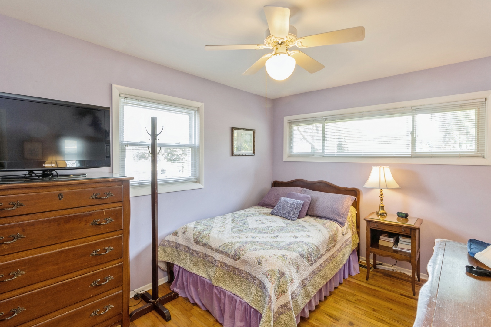 540 Newark Lane Hoffman Estates, IL 60169 - Photo 7 of 10 a bedroom with a bed and a flat screen tv