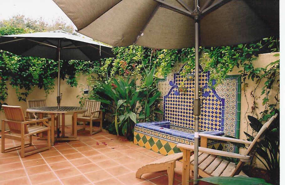 Prospect Santa Barbara, CA 93103 - Photo 1 of 1 an outdoor sitting area with furniture and umbrella