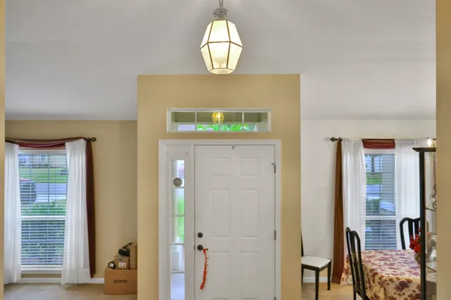 a view of a dining room with furniture window and outside view