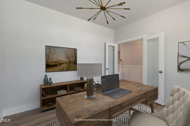 a kitchen with stainless steel appliances granite countertop a kitchen island a stove a table and chairs in it