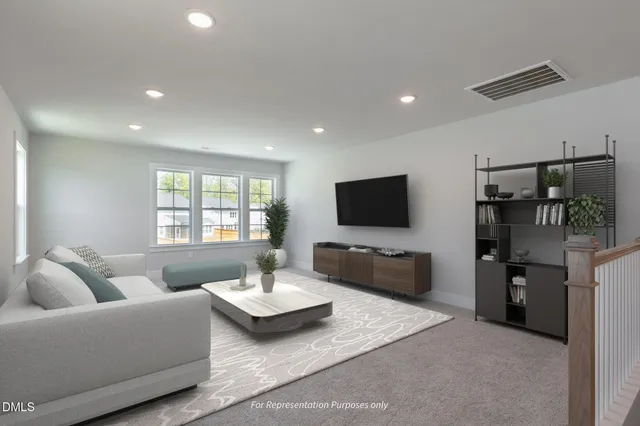 a bedroom with a large bed and a couch