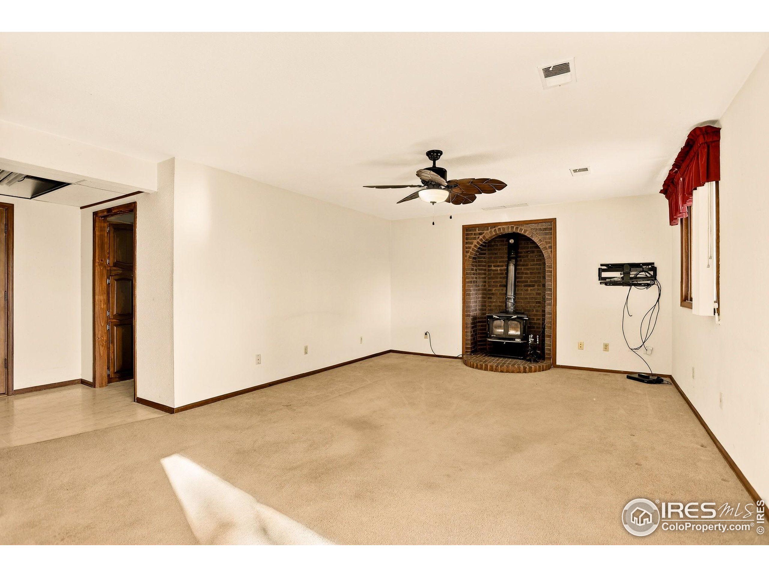 809 Jay Place Berthoud, CO 80513 - Photo 11 of 31 a view of a livingroom with a fireplace