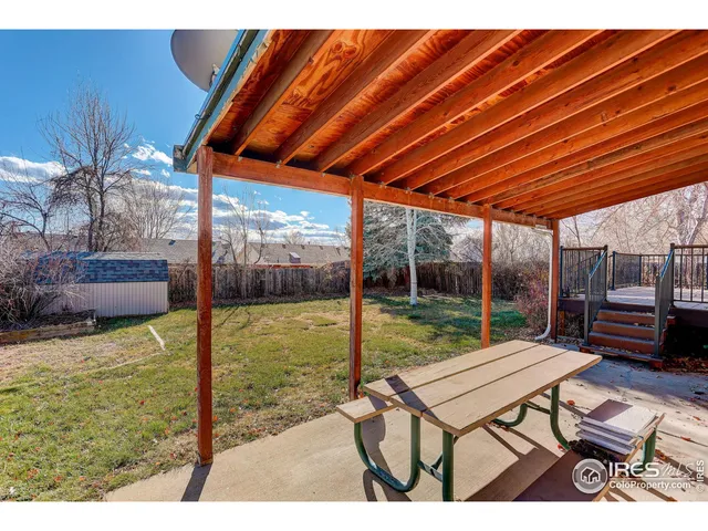 a house view with a sitting space and garden