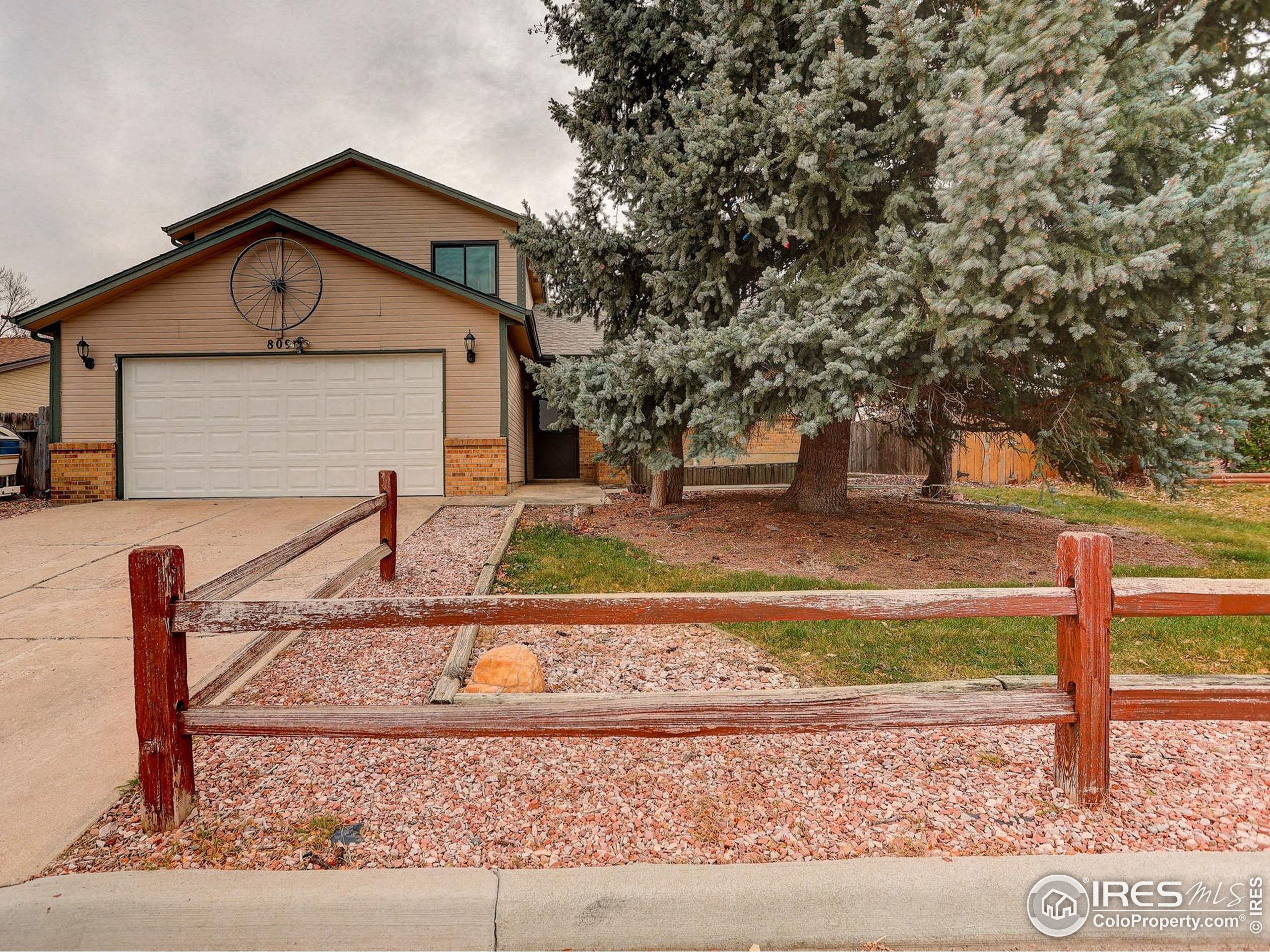 809 Jay Place Berthoud, CO 80513 - Photo 31 of 31 a front view of a house with garden