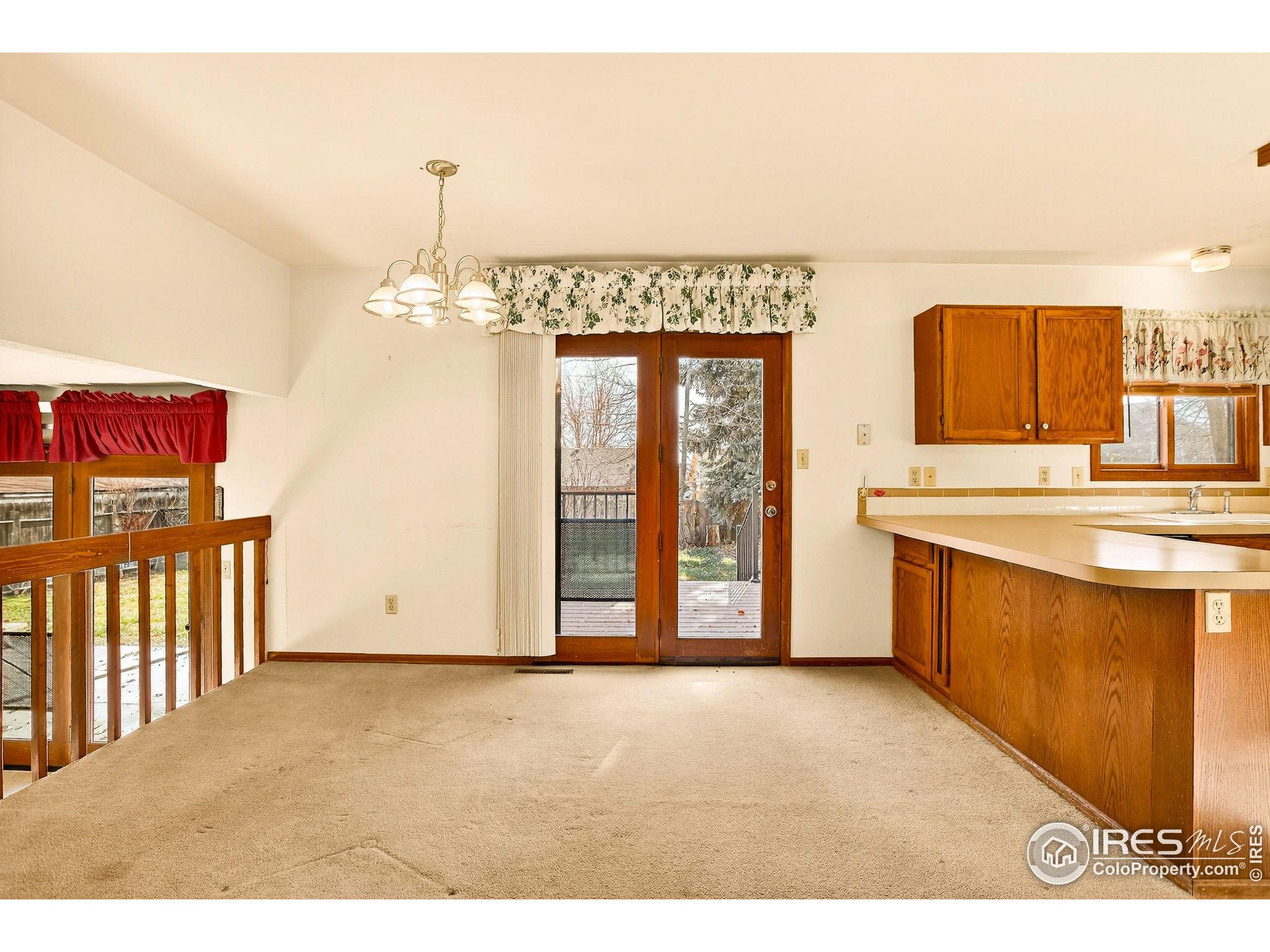 809 Jay Place Berthoud, CO 80513 - Photo 7 of 31 a view of a kitchen with a sink and a large window