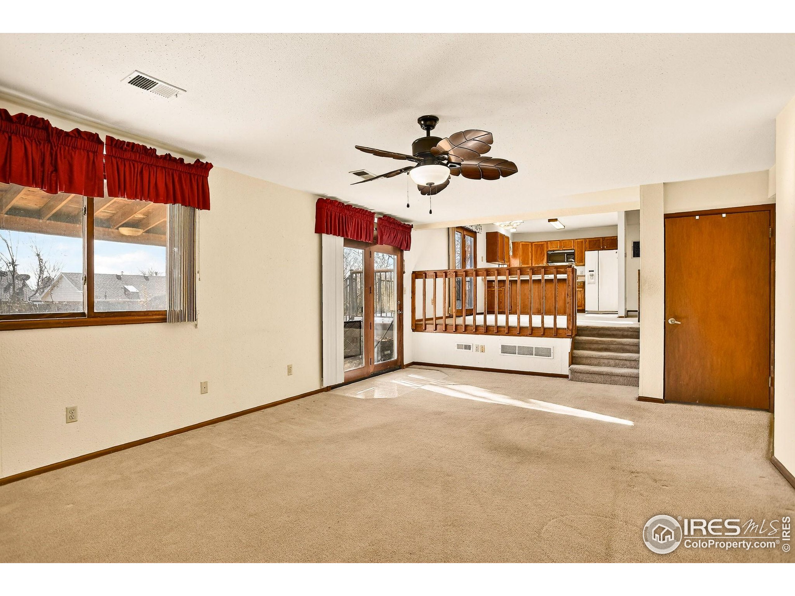 809 Jay Place Berthoud, CO 80513 - Photo 9 of 31 a view of an empty room with a window