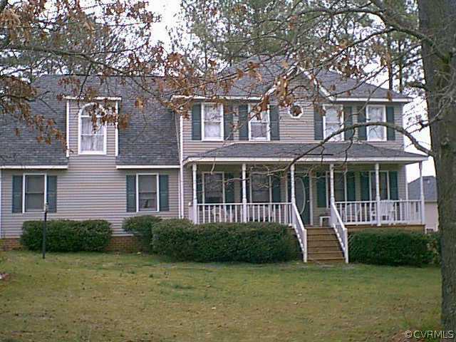 5217 Takach Road Prince George, VA 23875 - Photo 1 of 1 a front view of a house with a garden