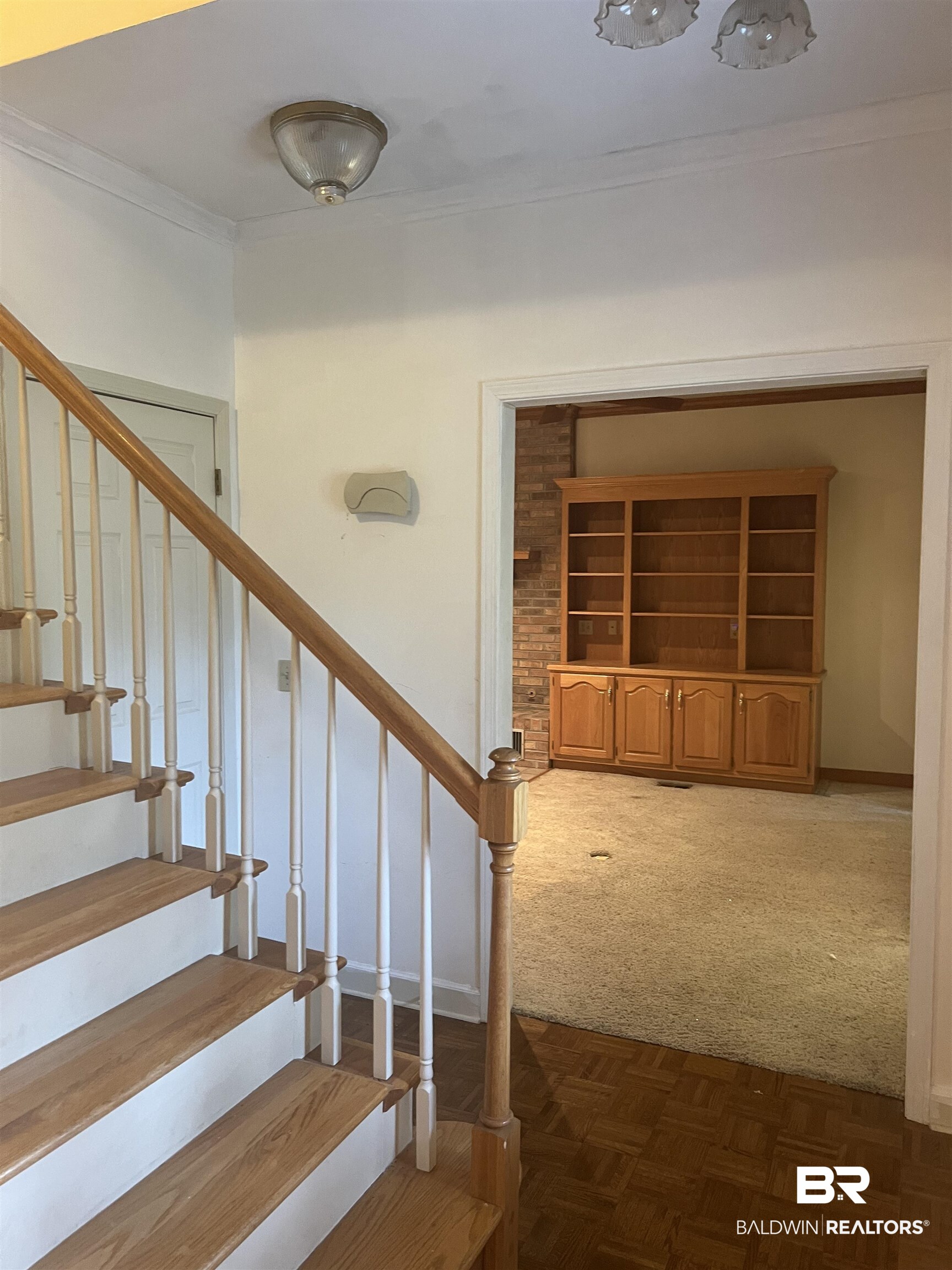 295 Norwood Road Monroeville, AL 36460 - Photo 20 of 32 Stairs with carpet flooring, baseboards, and crown molding