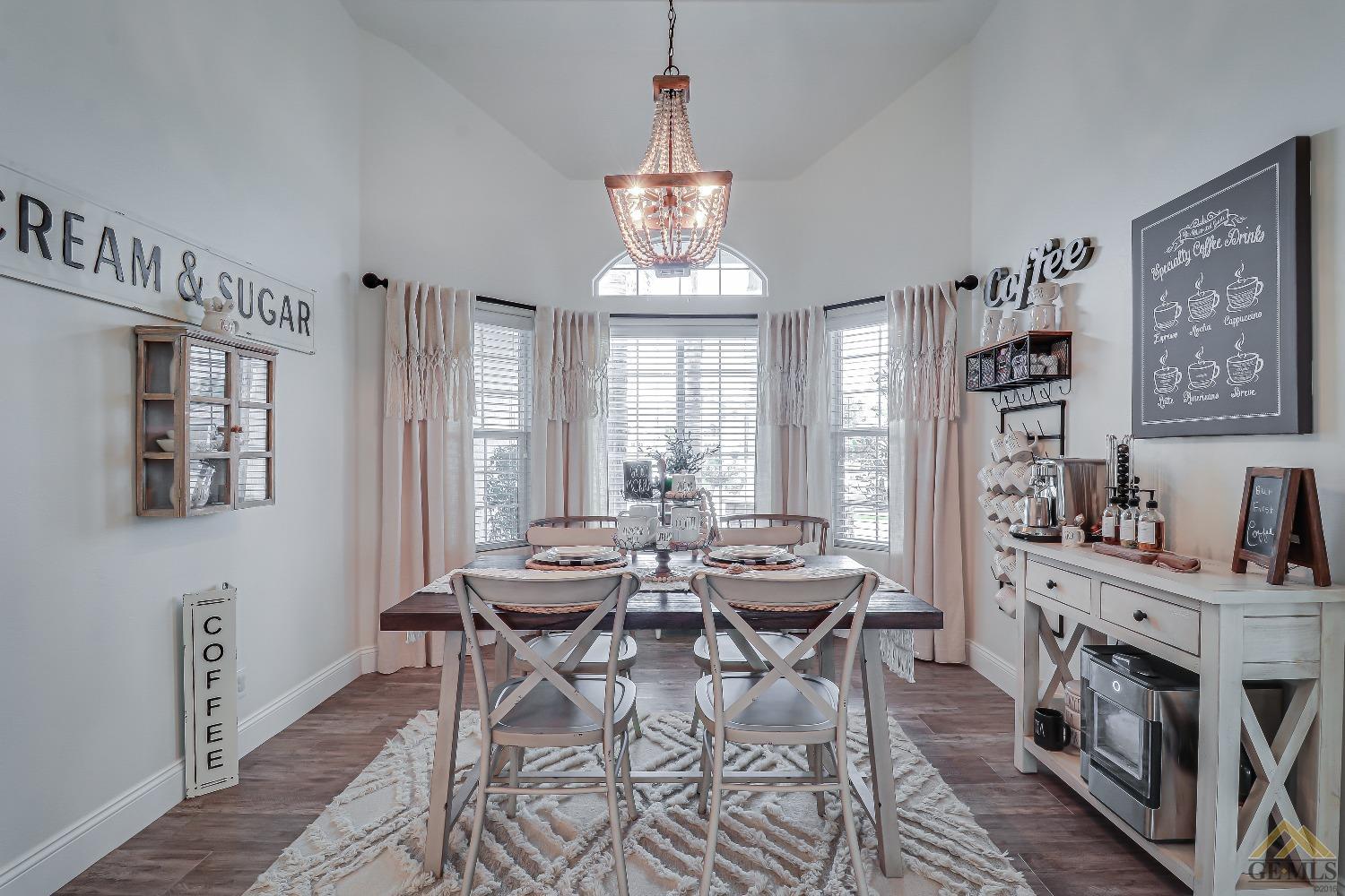 Undisclosed Address Bakersfield, CA 93314 - Photo 14 of 30 a view of a dining room with furniture window and wooden floor