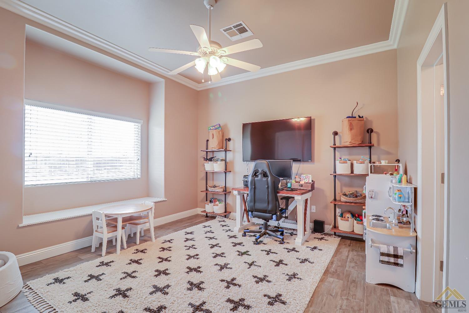 Undisclosed Address Bakersfield, CA 93314 - Photo 18 of 30 a living room with furniture a chandelier and a window