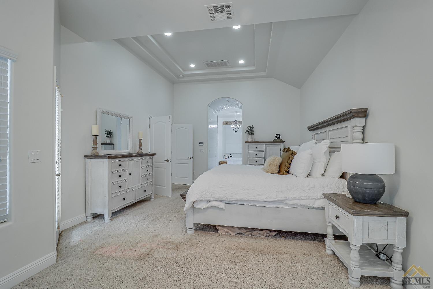 Undisclosed Address Bakersfield, CA 93314 - Photo 21 of 30 a bedroom with a bed and a window