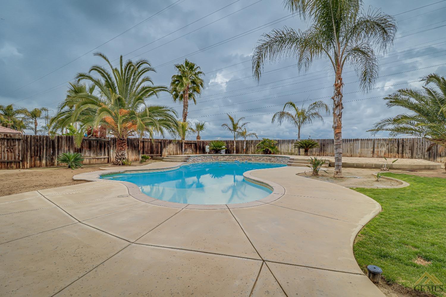 Undisclosed Address Bakersfield, CA 93314 - Photo 25 of 30 a view of outdoor space with swimming pool and lounge chair