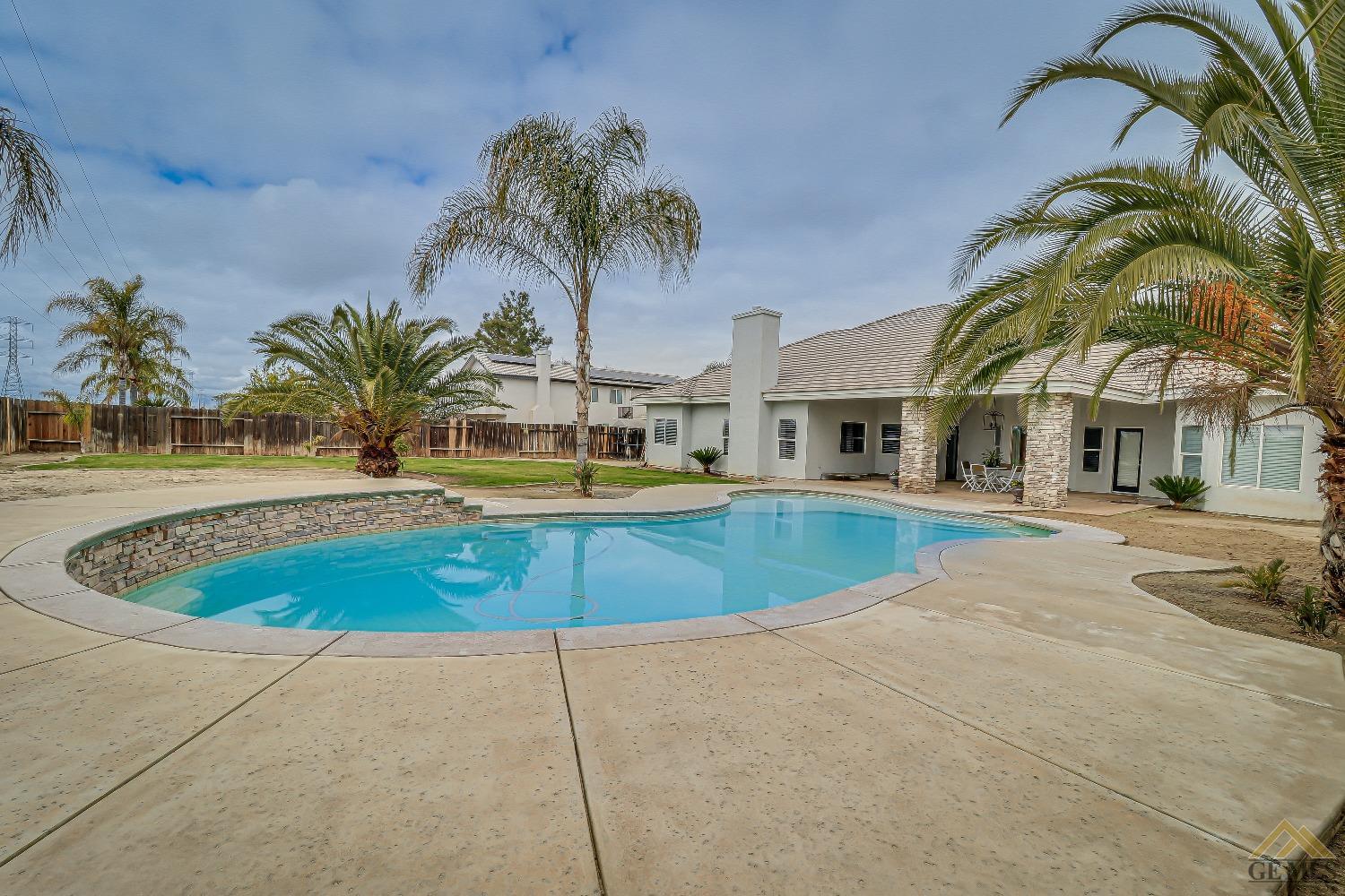 Undisclosed Address Bakersfield, CA 93314 - Photo 26 of 30 a view of swimming pool with outdoor seating and yard