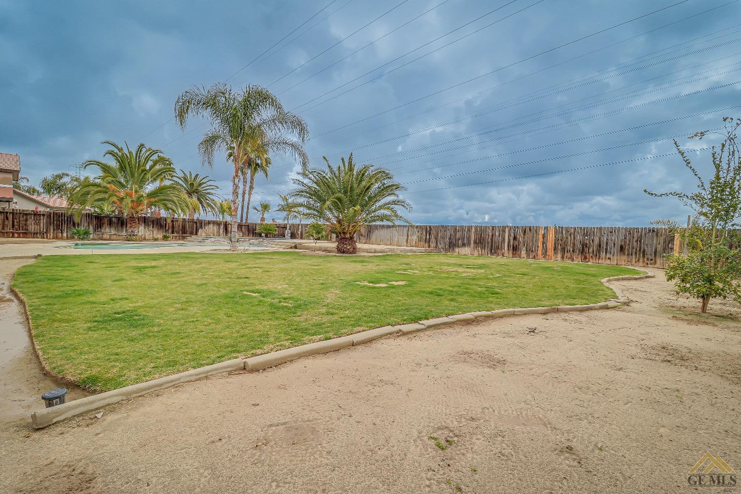 Undisclosed Address Bakersfield, CA 93314 - Photo 27 of 30 a view of a swimming pool and an outdoor space