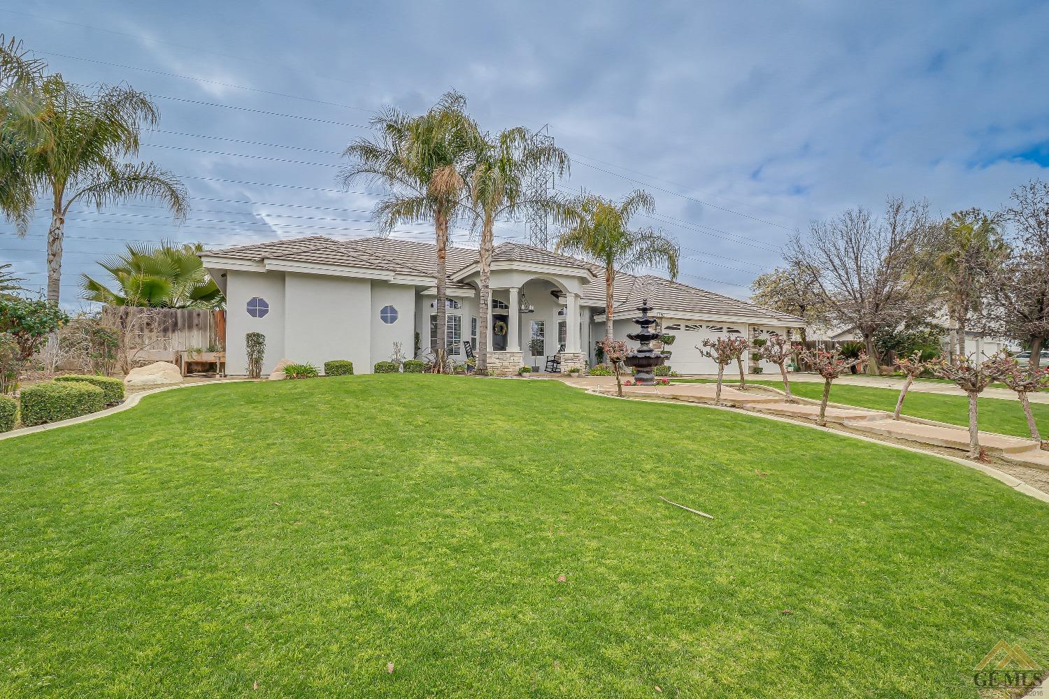 Undisclosed Address Bakersfield, CA 93314 - Photo 3 of 30 a front view of house with yard and green space