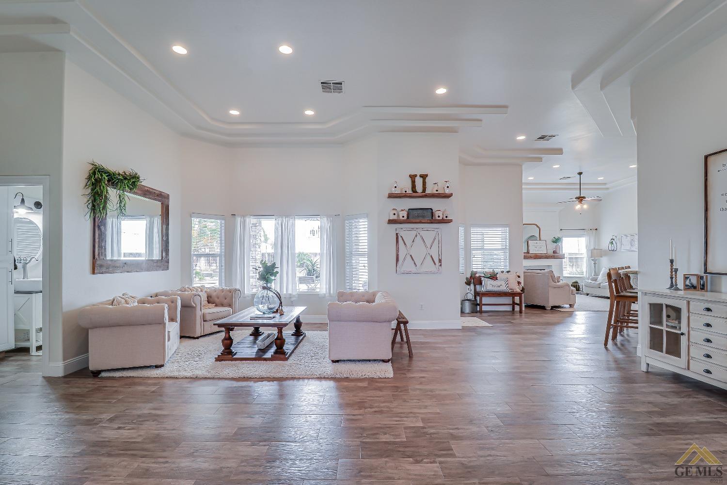Undisclosed Address Bakersfield, CA 93314 - Photo 5 of 30 a living room with furniture and a wooden floor