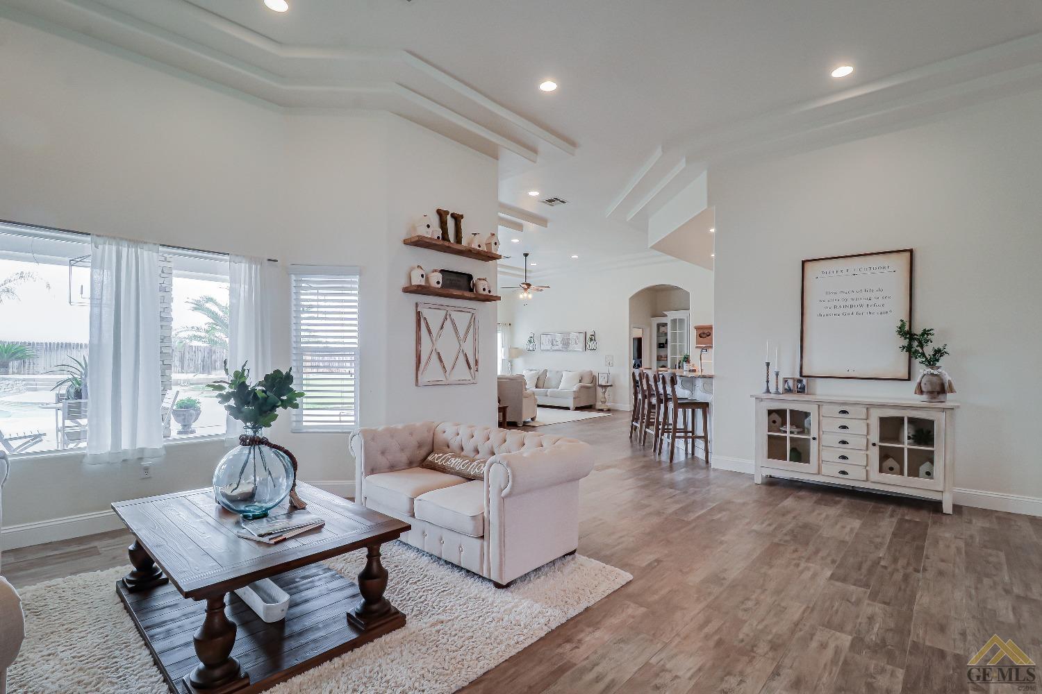Undisclosed Address Bakersfield, CA 93314 - Photo 6 of 30 a living room with furniture and a fireplace