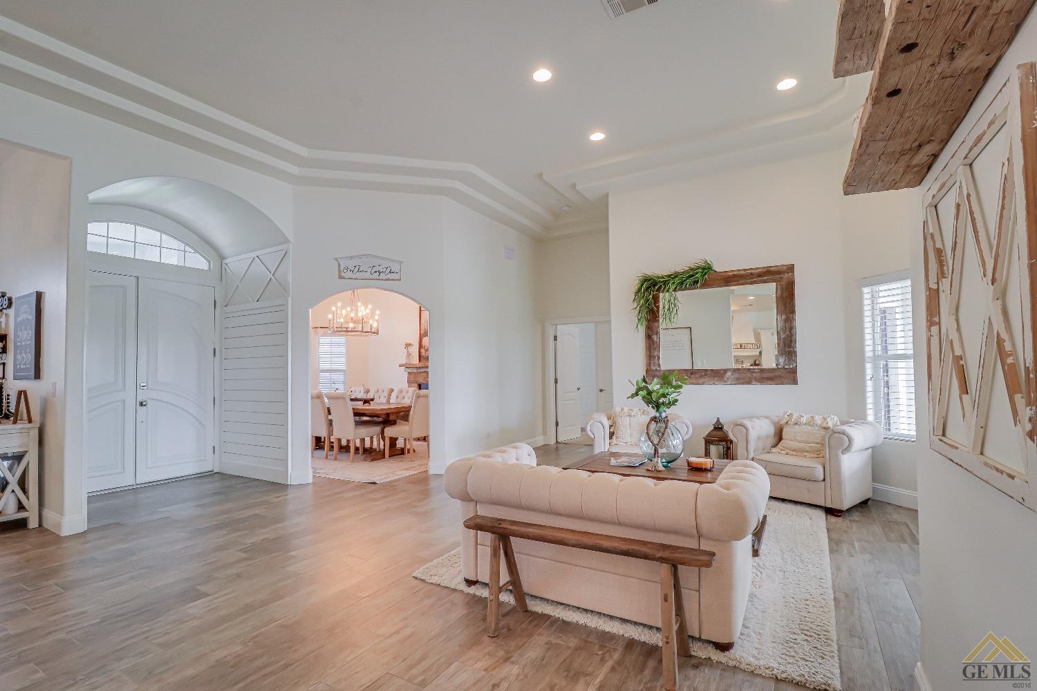 Undisclosed Address Bakersfield, CA 93314 - Photo 7 of 30 a living room with furniture and a wooden floor