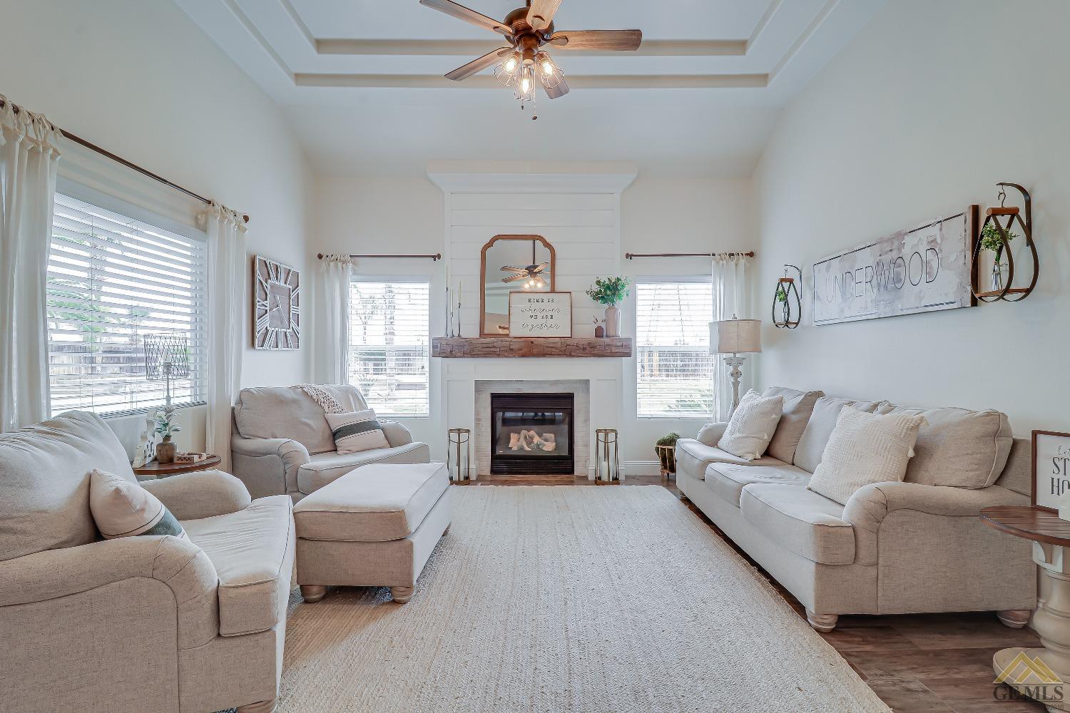 Undisclosed Address Bakersfield, CA 93314 - Photo 9 of 30 a living room with furniture and a fireplace