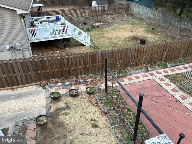 a view of yard with patio