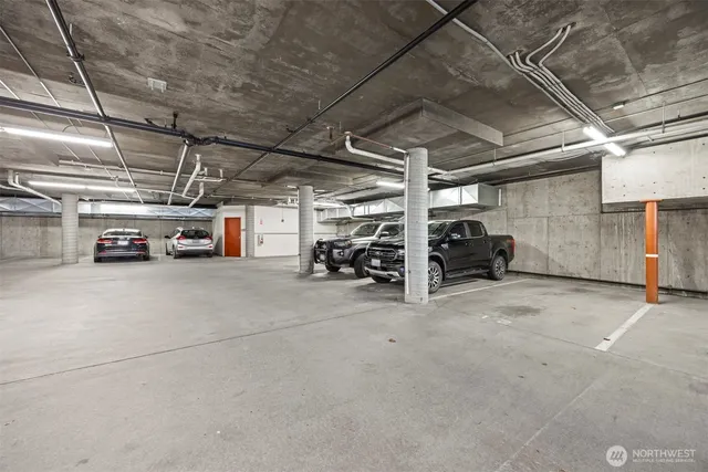 a view of parking garage with cars