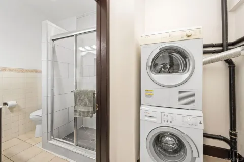 a view of a bathroom with washing machine